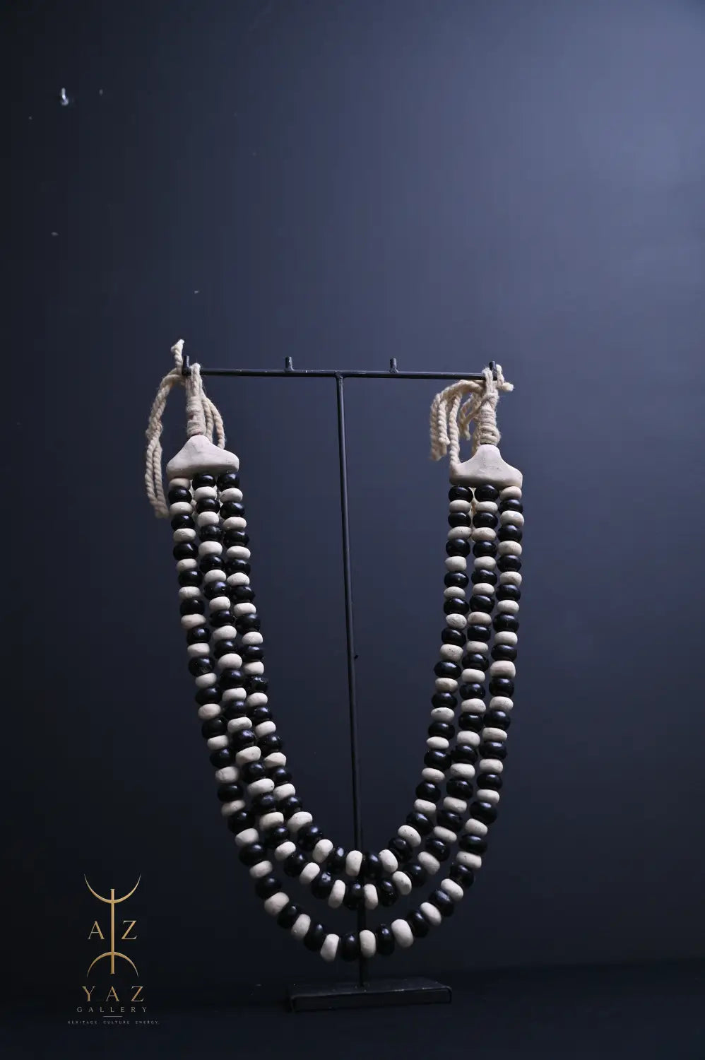 Monochrome Heritage Pendant Sculpture – Ivory & Black Beads with Ivory Rope on Black Stand (62 × 34 cm)