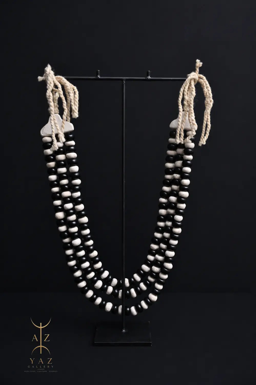 Monochrome Heritage Pendant Sculpture – Ivory & Black Beads with Ivory Rope on Black Stand (62 × 34 cm)
