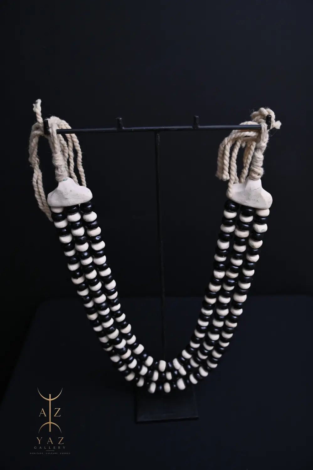 Monochrome Heritage Pendant Sculpture – Ivory & Black Beads with Ivory Rope on Black Stand (62 × 34 cm)