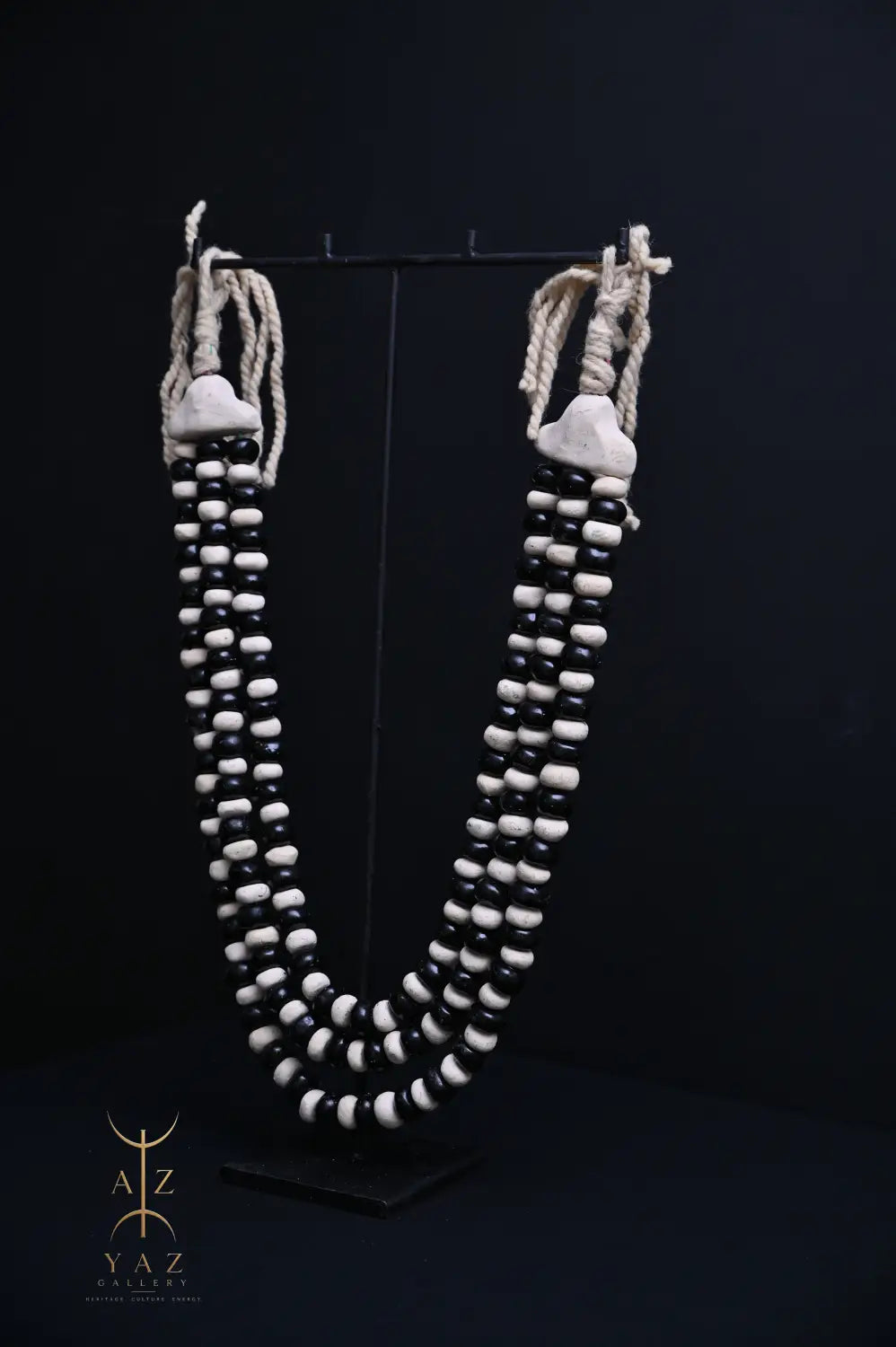 Monochrome Heritage Pendant Sculpture – Ivory & Black Beads with Ivory Rope on Black Stand (62 × 34 cm)
