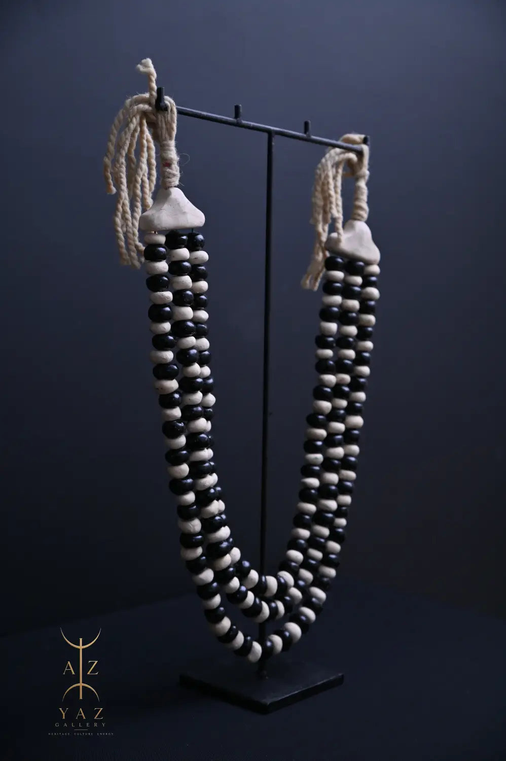 Monochrome Heritage Pendant Sculpture – Ivory & Black Beads with Ivory Rope on Black Stand (62 × 34 cm)