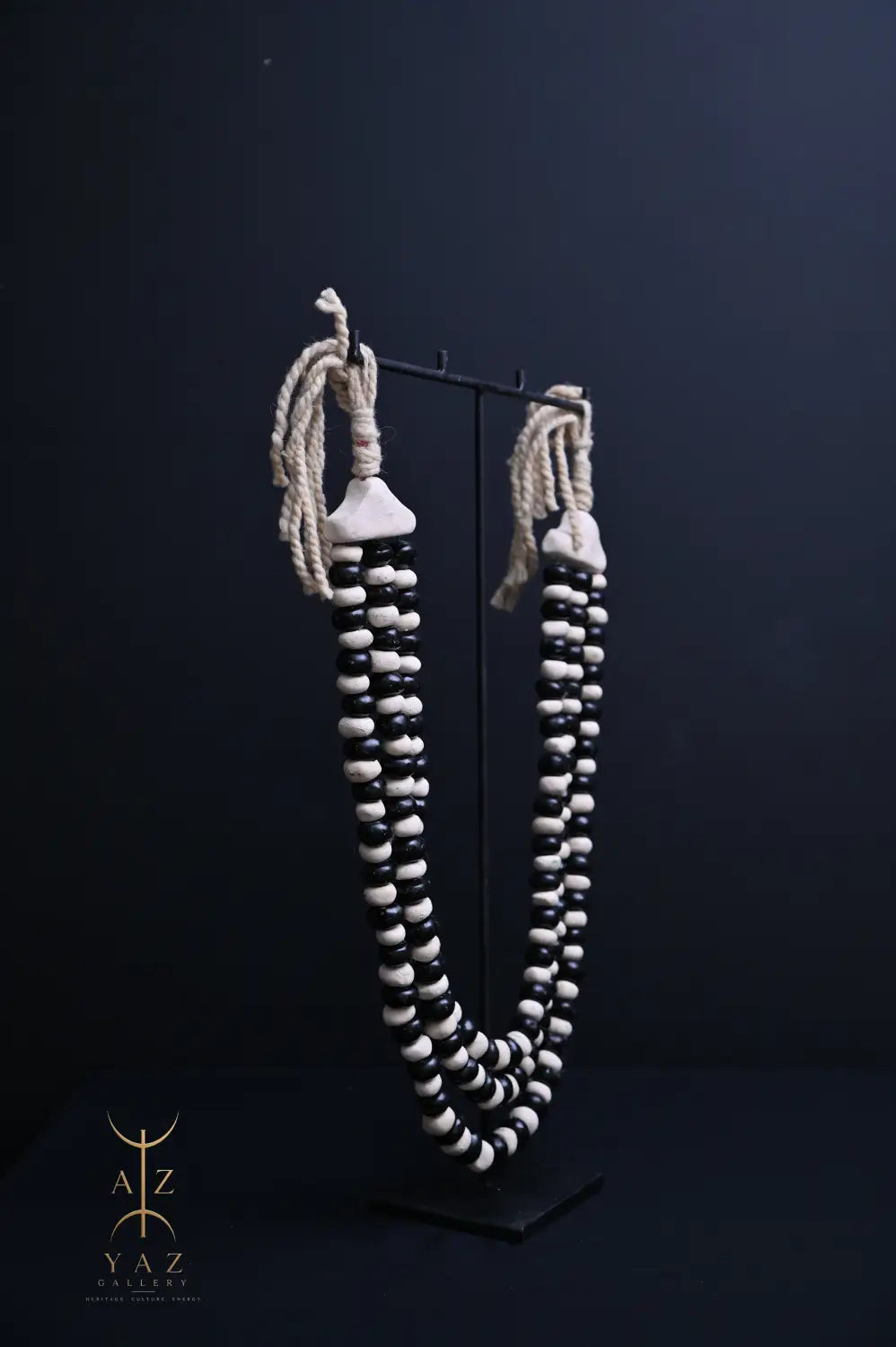 Monochrome Heritage Pendant Sculpture – Ivory & Black Beads with Ivory Rope on Black Stand (62 × 34 cm)