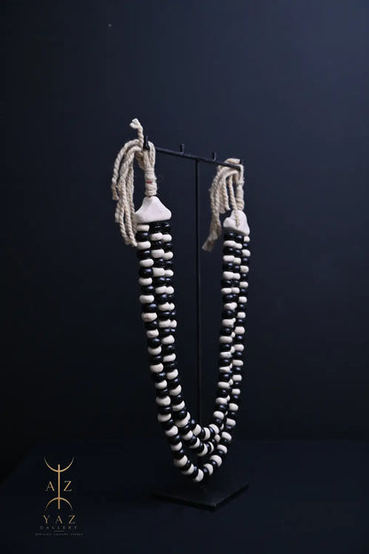 Monochrome Heritage Pendant Sculpture – Ivory & Black Beads with Ivory Rope on Black Stand (62 × 34 cm)