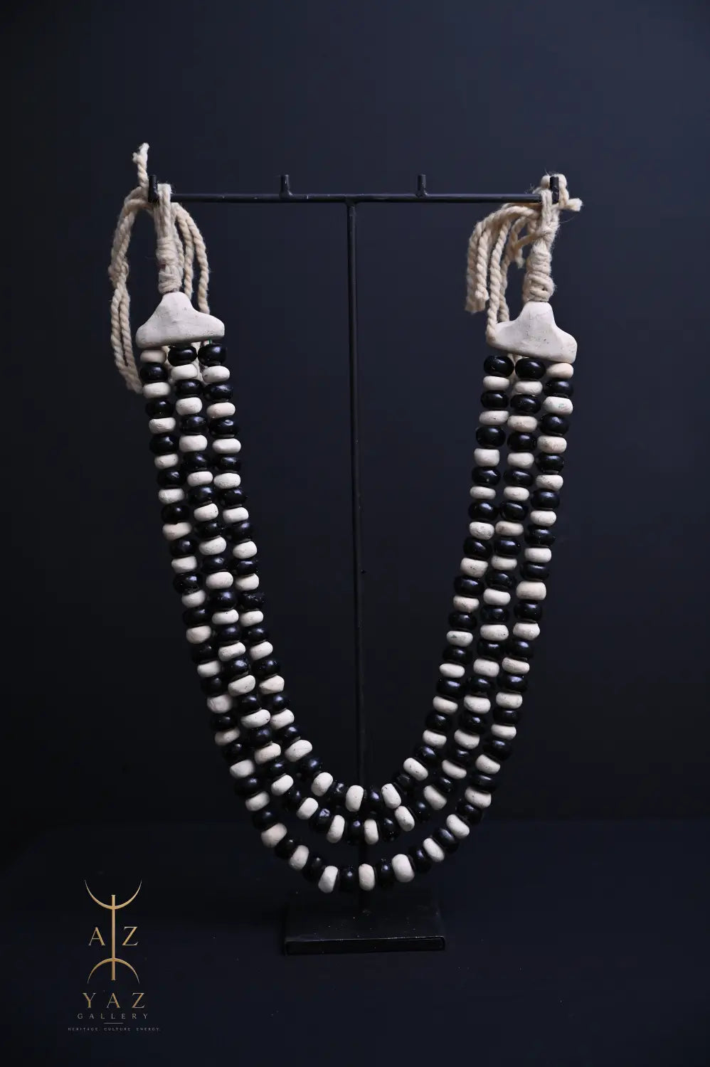 Monochrome Heritage Pendant Sculpture – Ivory & Black Beads with Ivory Rope on Black Stand (62 × 34 cm)
